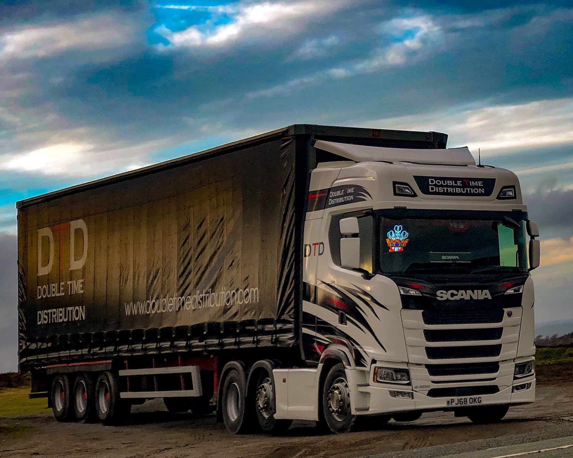 Double Time Distribution curtainsider articulated lorry on a North Wales road