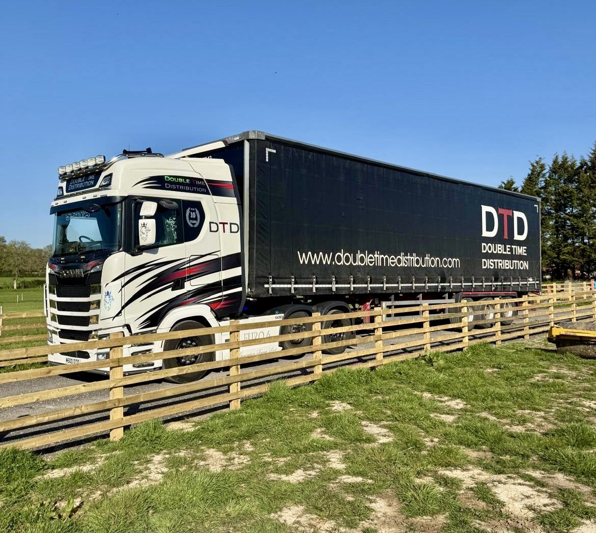 Double Time Distribution curtainsider artic on a rural North Wales road