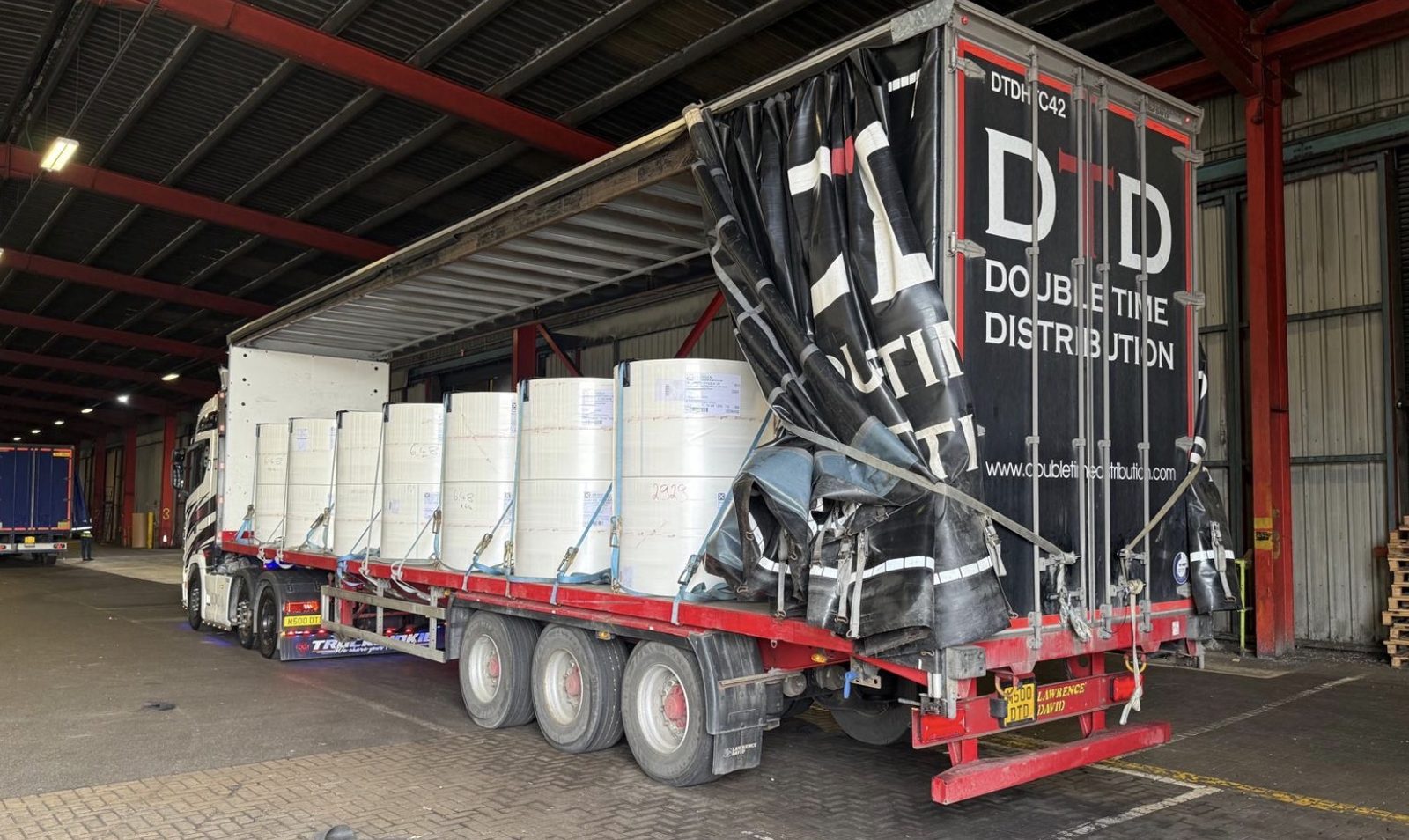 Curtainsider artic loading at a manufacturing warehouse in North Wales