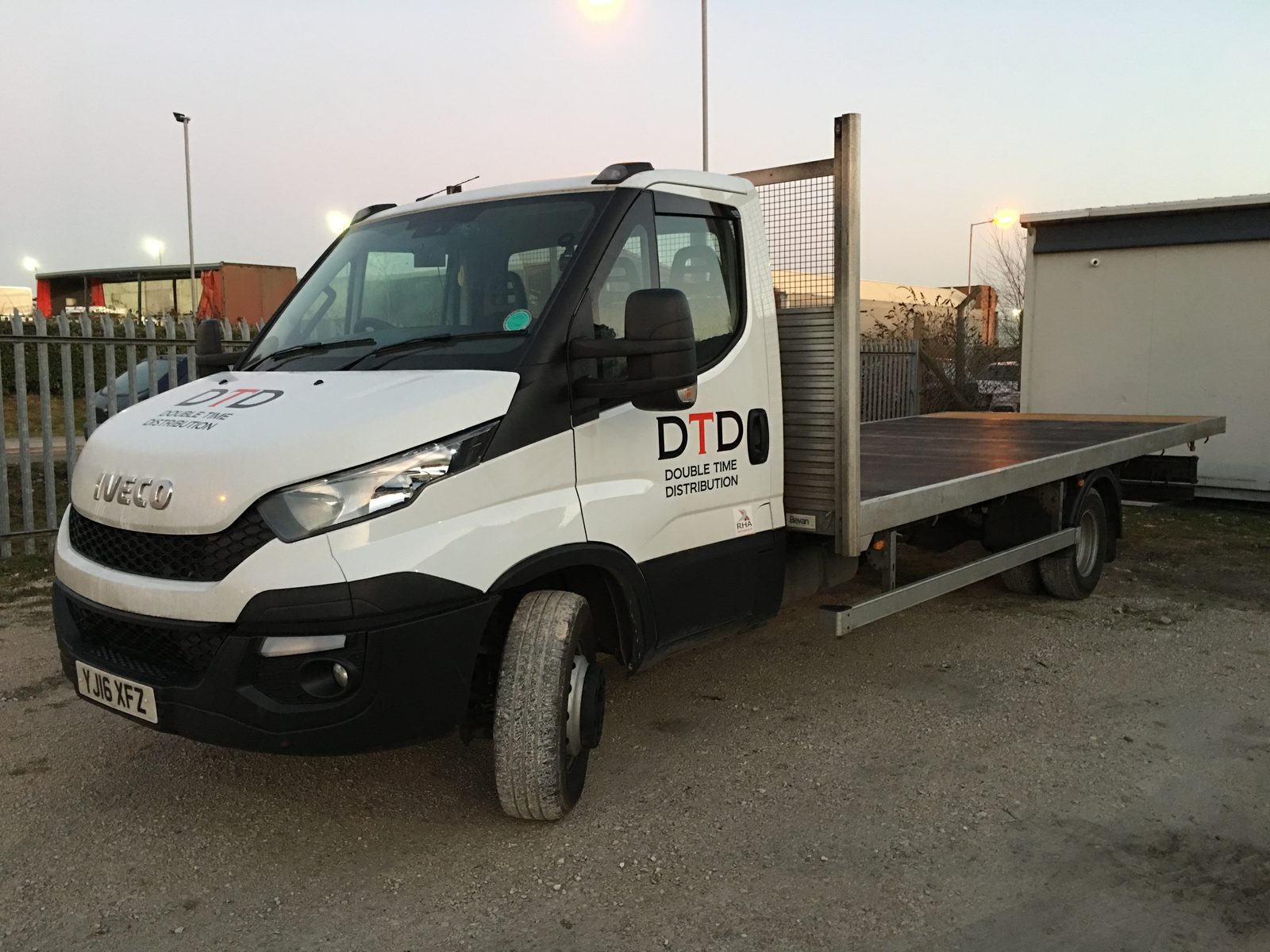 Double Time Distribution flatbed truck making a local delivery